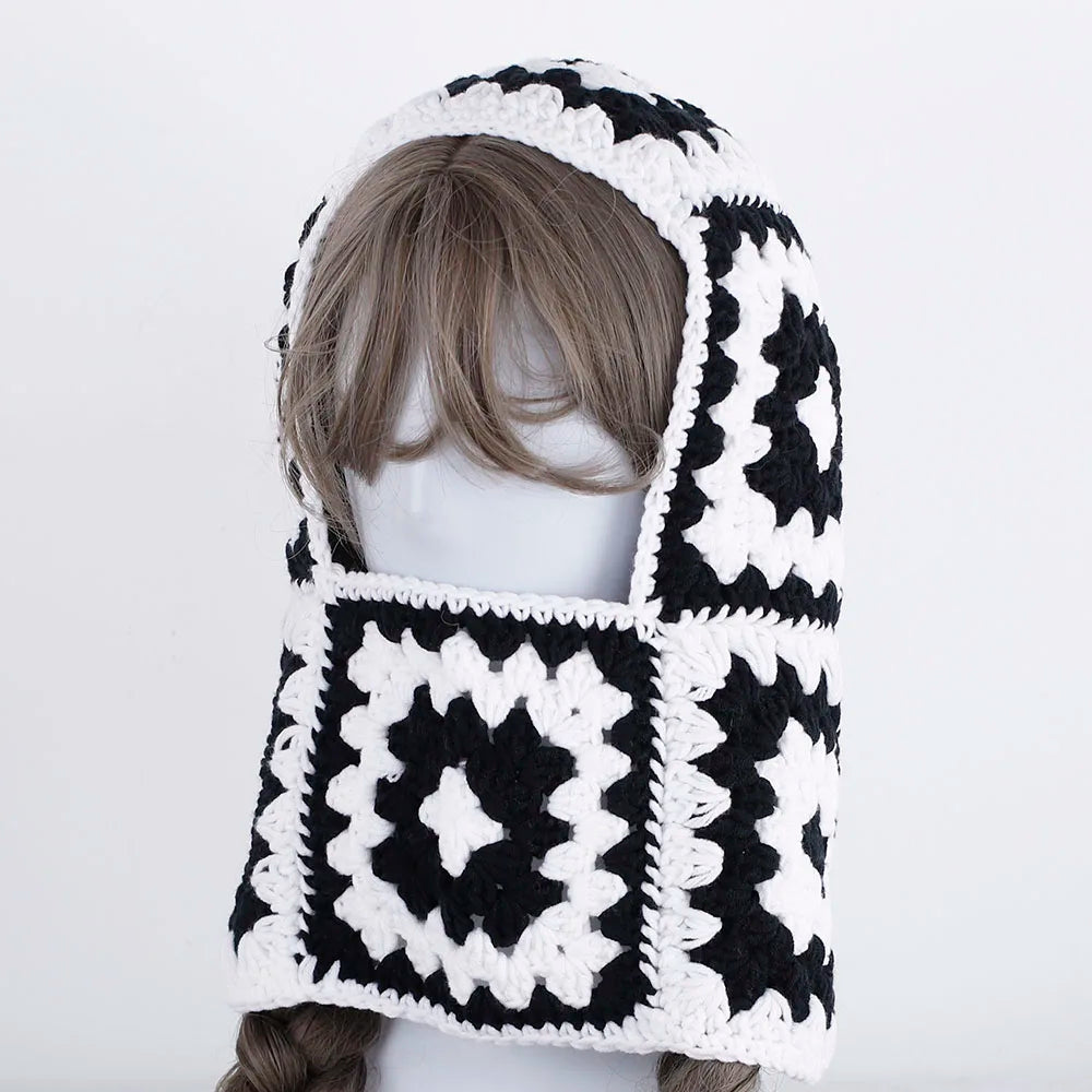 Crocheted black and white geometric hooded scarf on mannequin for Peoria balaclava knit