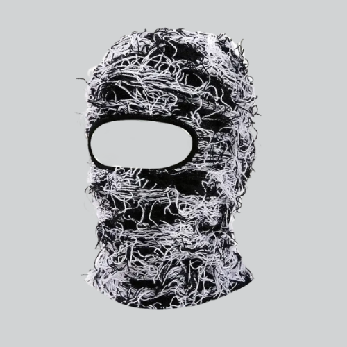 Distressed knit balaclava by Columbia featuring tangled black and white fibers