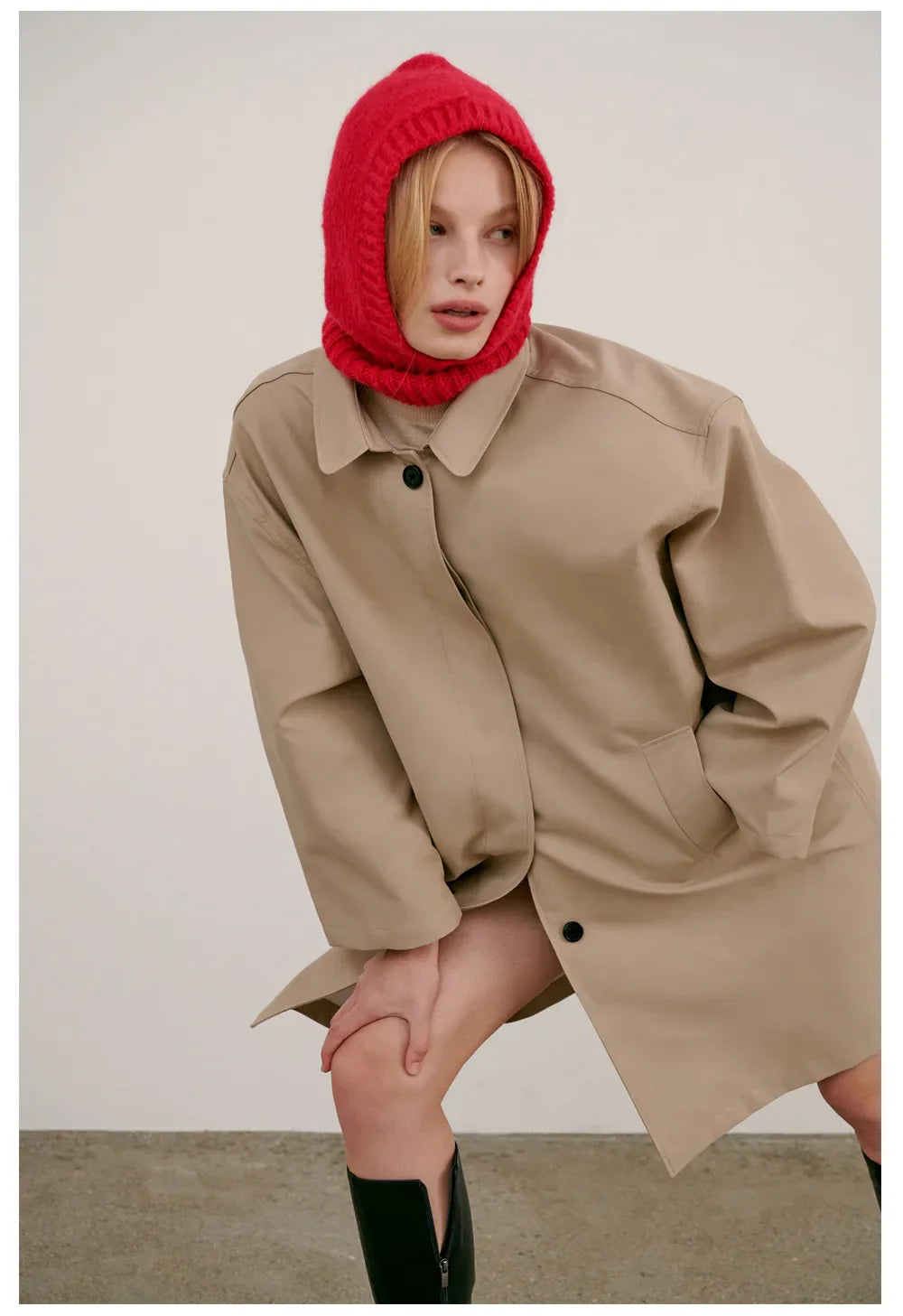 Beige oversized coat with collared neckline, complementing the Knitted Hood Balaclava