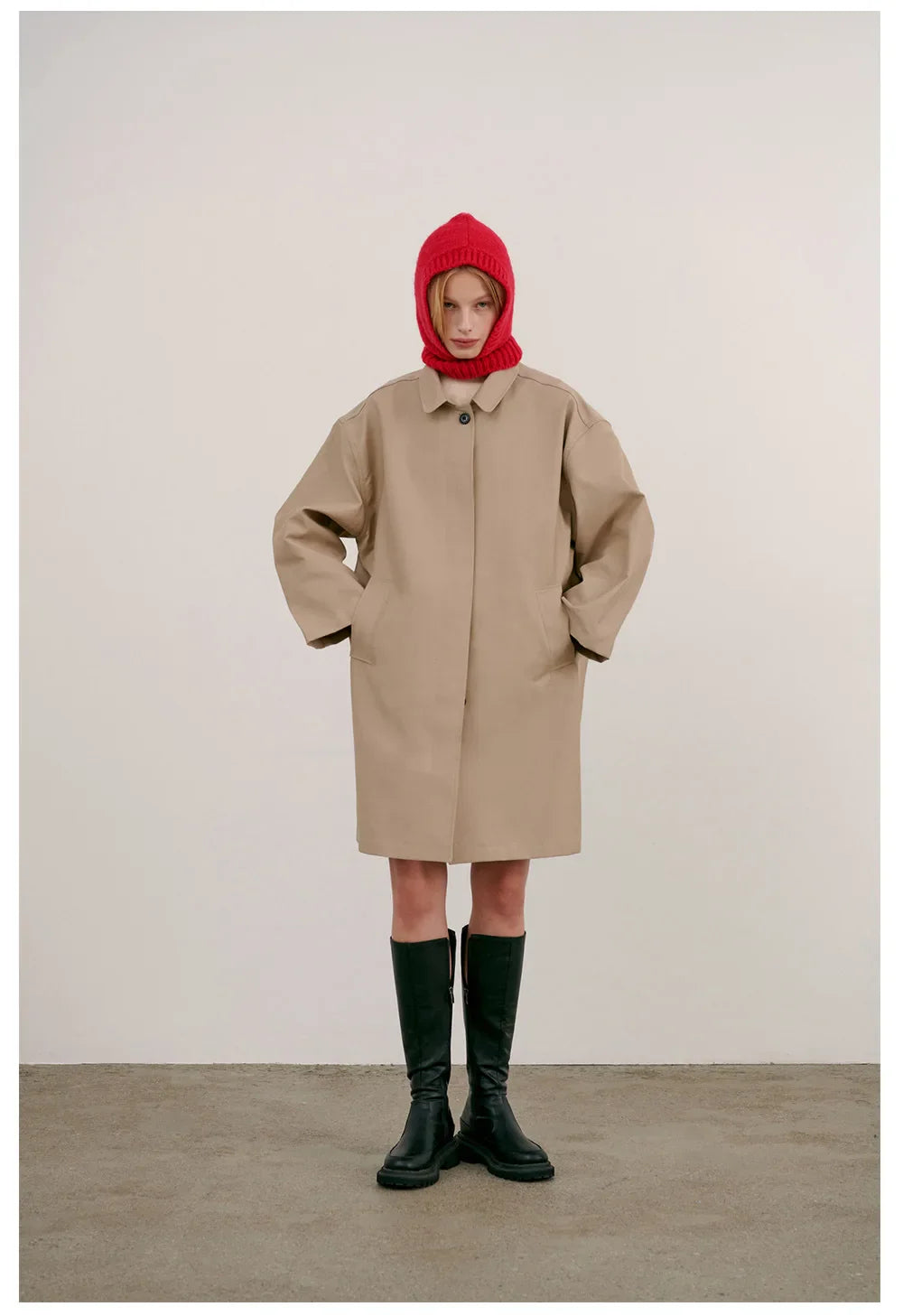 Beige oversized coat over red Knitted Hood Balaclava and black tall boots