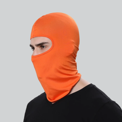 Bright orange Thermal Cycling Balaclava from Oakland covering head and face, eyes exposed