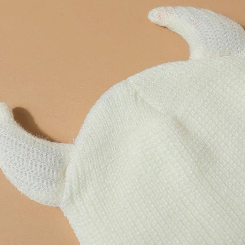 White knitted balaclava for women with horn detail, part of the women’s balaclava collection