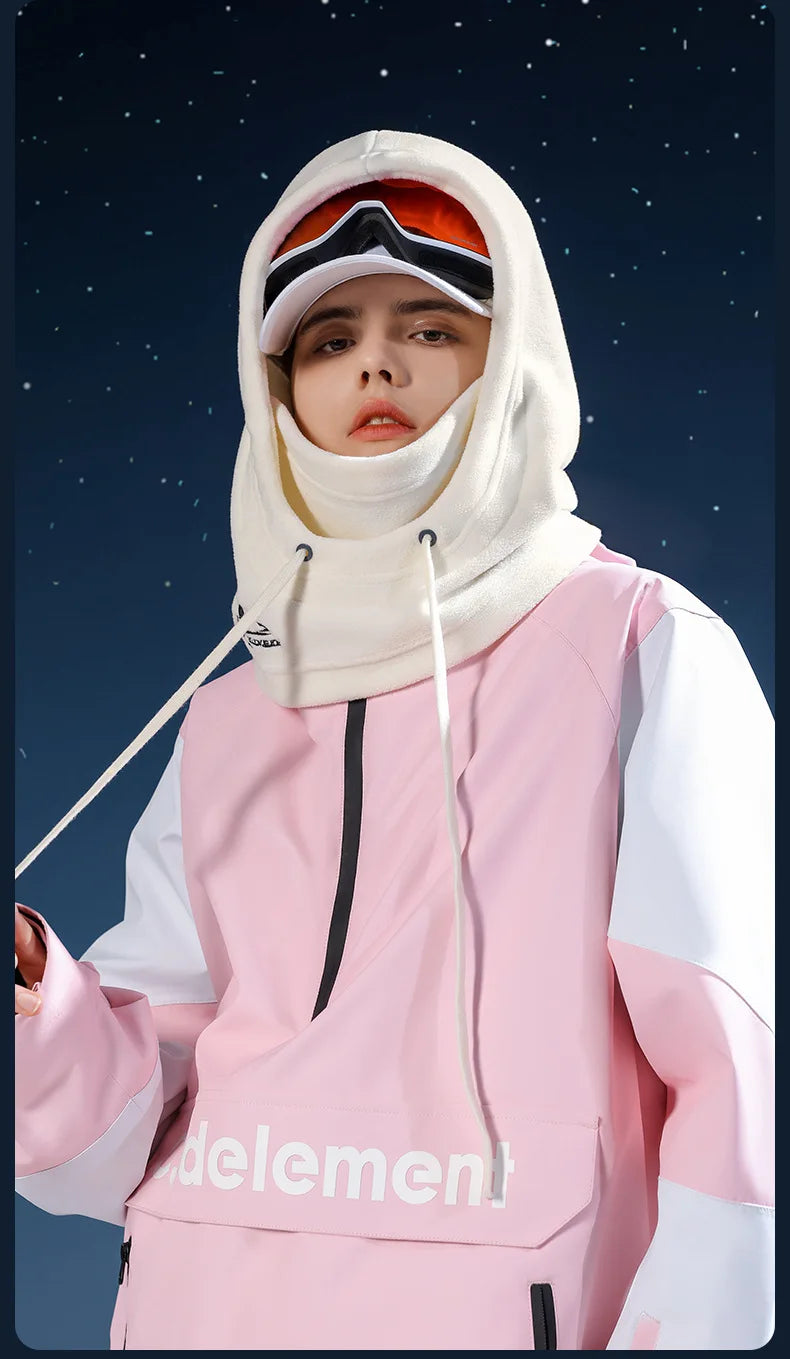 Person wearing a pink and white hooded ski jacket with delement branding and a white balaclava hood